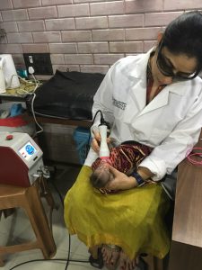 injured monkey being fed by vet