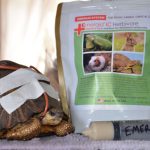 healing turtle next to large bag of Emeraid